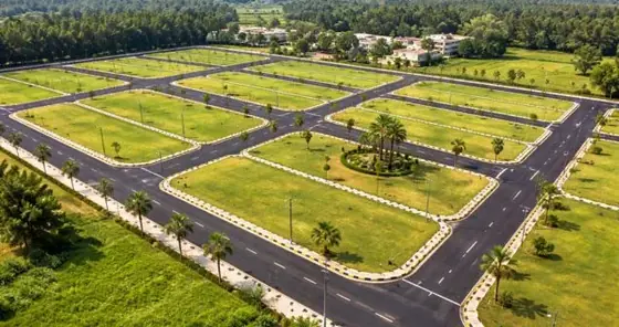 Illustration of a plotted layout with landscaped roads, shown for KNS Chikkaluru